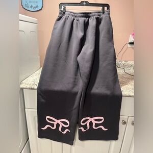 Edikted Gray Sweatpants with Pink Bow Accents.